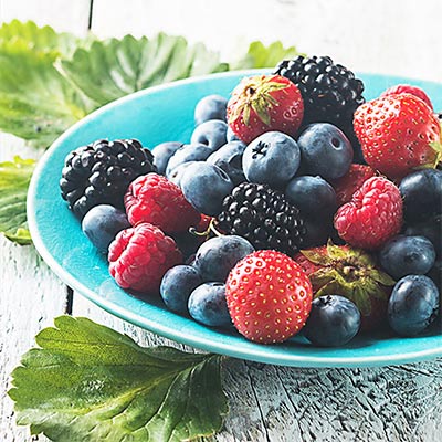 Image of furits that boost Brain Health. Strawberries, Blue Berries and more shared Approved Healthcare Etobicoke
